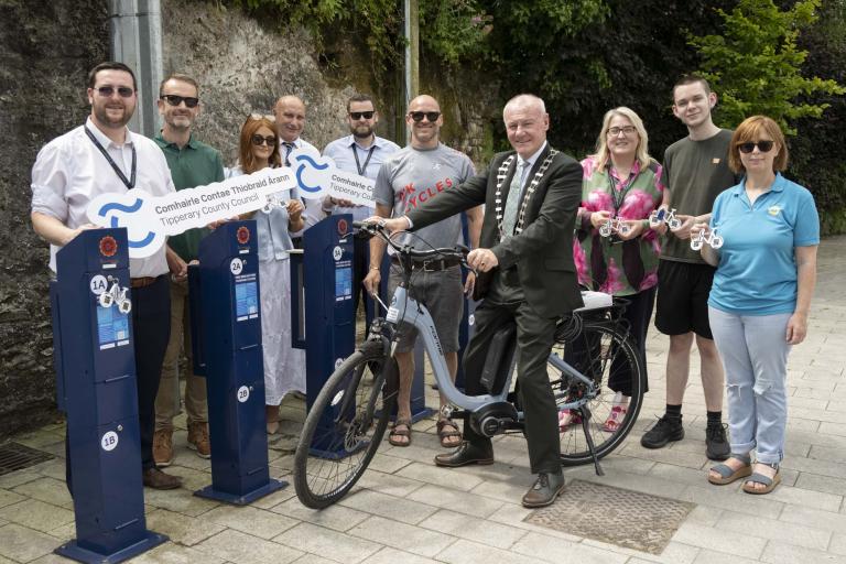 Carrick District Management posing with the Bike Chargers and O'K Cycles