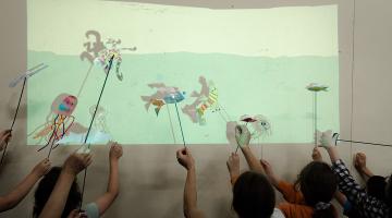 Image of children with shadow puppets
