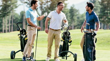 three men playing golf